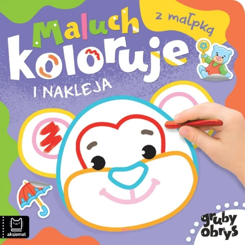 Maluch kolorujei nakleja z małpką. Gruby obrys
