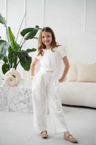 Kombinezon dziewczęcy Anbor z ozdobnym kwiatem na ramieniu śmietankowy